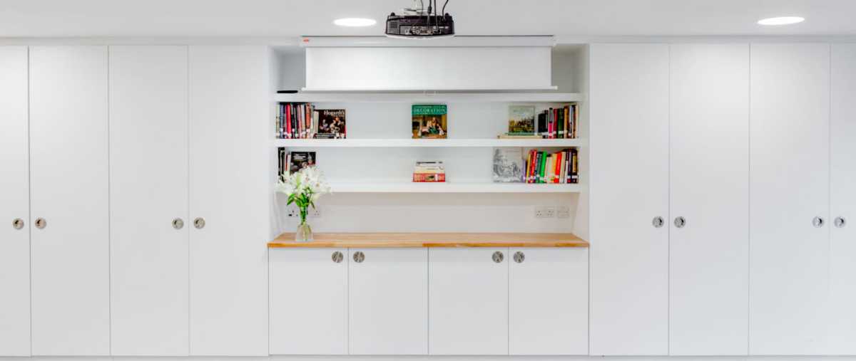 A wall of built-in storage in the Clore Creative Studio at the Foundling Museum, London. Photo Dan Weil