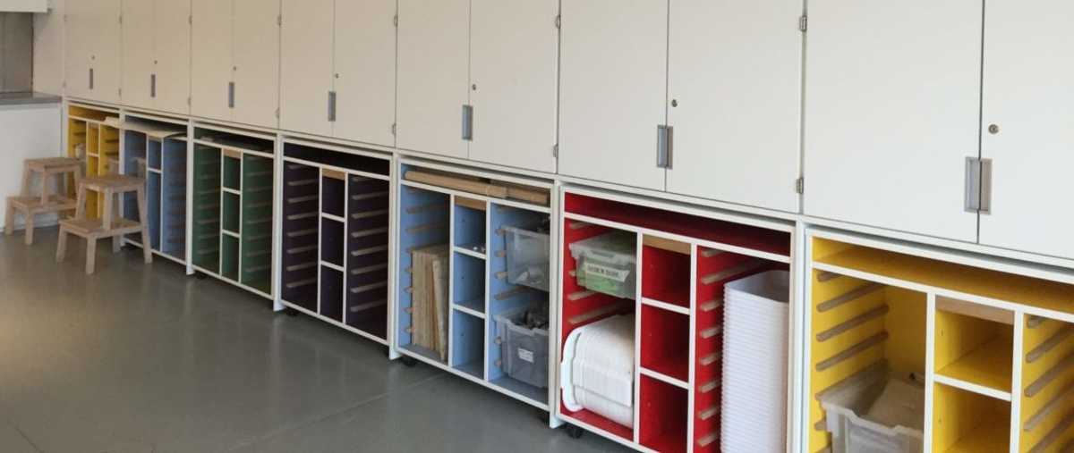 The built-in storage in Studio Two at the Hepworth Wakefield includes pull-out storage pods that are stocked for specific sessions. The pods can be reversed to show a blank white surface for formal meetings and events